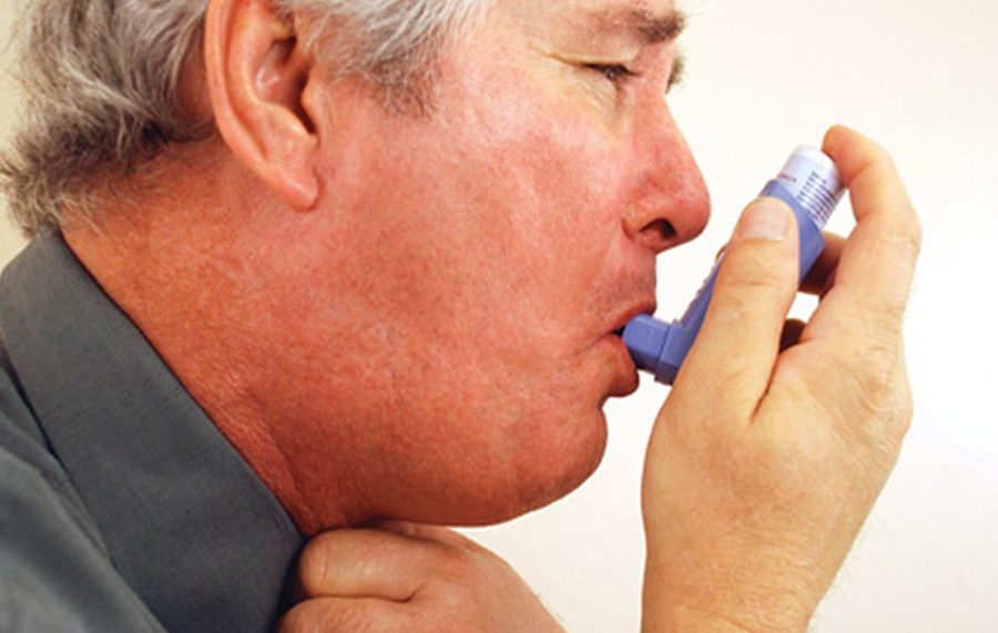 Asthma sufferer using puff