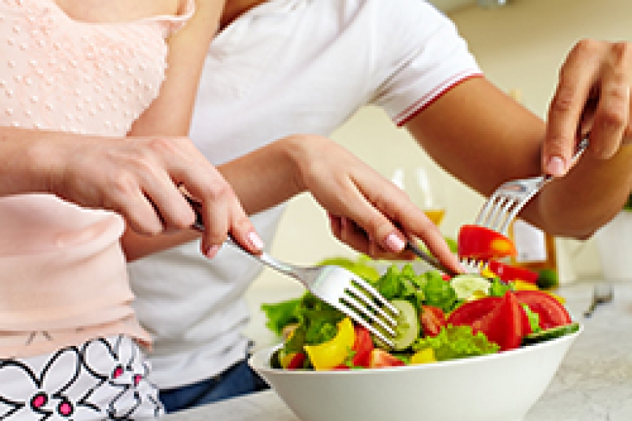 Mixing Salads Couple mixing salads together