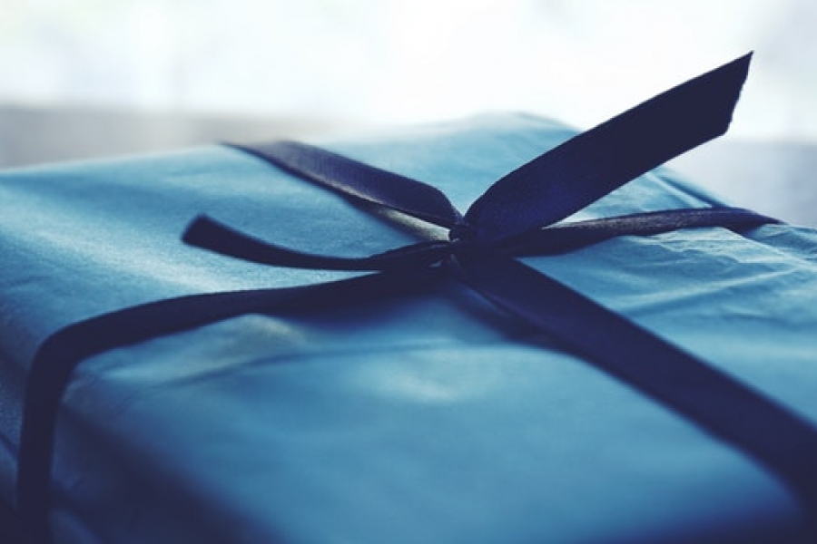 close-up-photo-of-tied-blue-box Boxed gift wrapped in blue