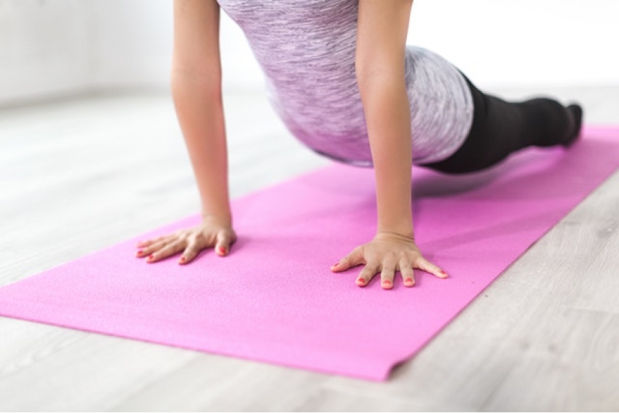 balance-body-exercise-female Female exercising body balance on mat