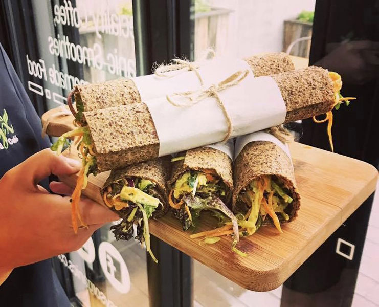 Image is of a serving board of healthy wraps 