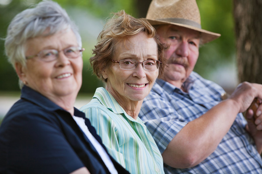 Row of smiling elderly folk Row of smiling elderly folk