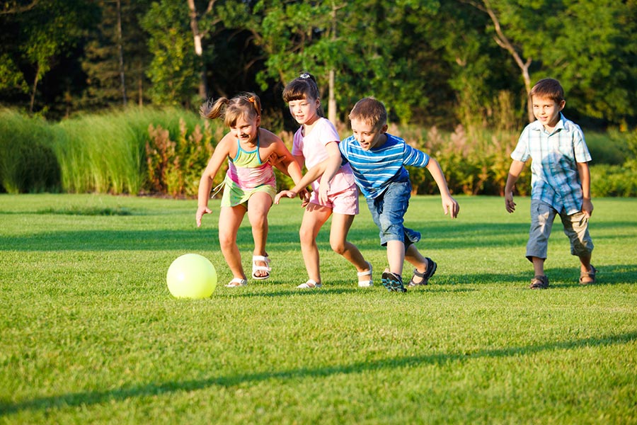 Kids chasing a ball