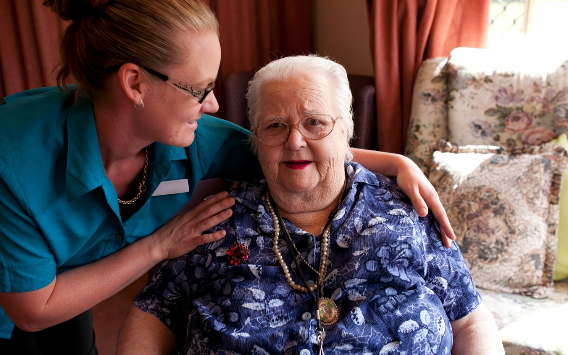 Elderly woman at home with nurse