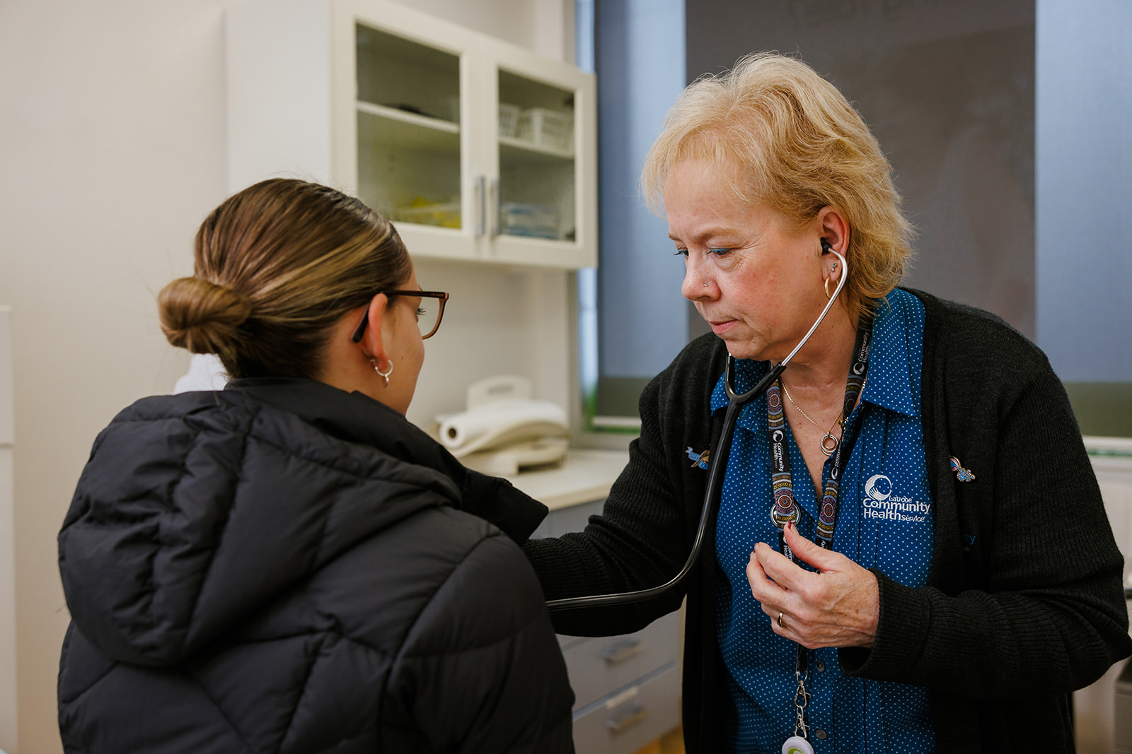 LCHS nurse using a stethoscope on a patient