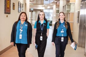 LCHS staff members walking in a hallway